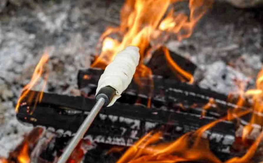 Image of Sweet stick bread dough with the stick bread spit