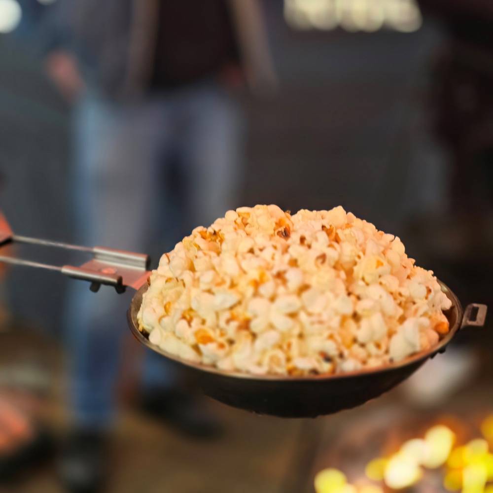 Petromax popcorn maker - preparing popcorn at the campfire