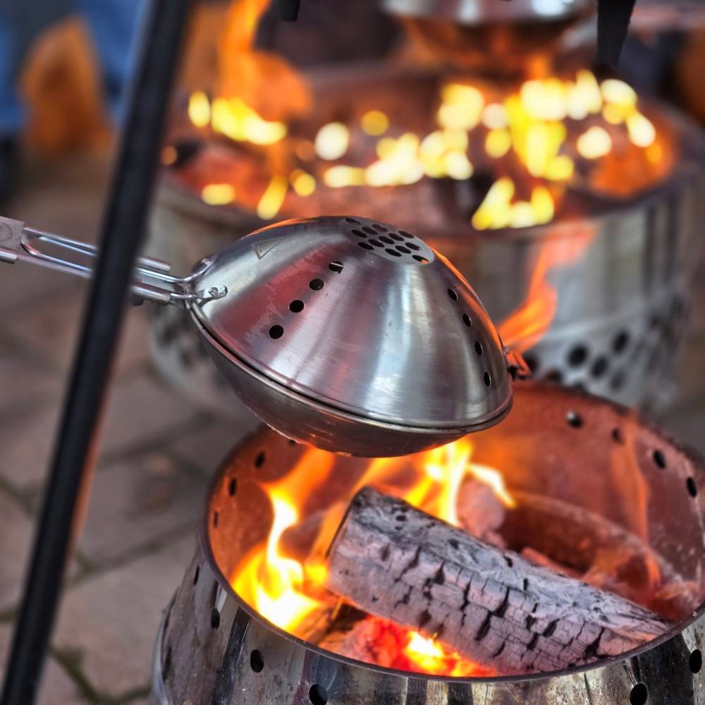 Petromax popcorn maker - preparing popcorn at the campfire